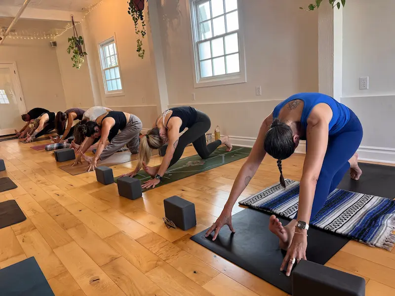 Group yoga class in a lunge stretch