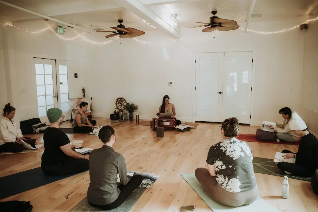 Adriane Alvarez leading a yoga teacher training class at Home Yoga Studio