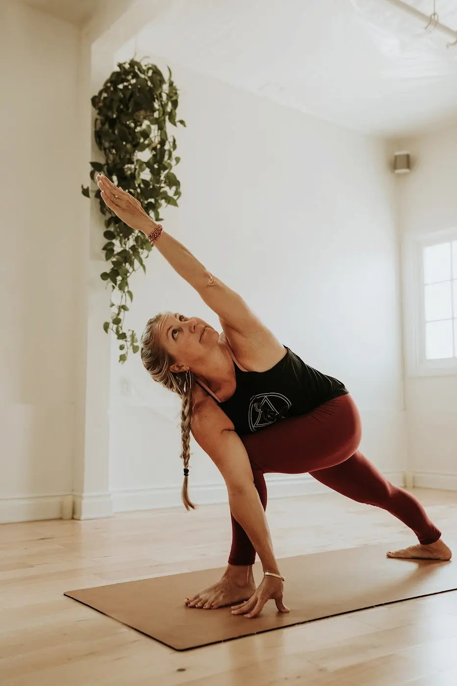 Woman in a side-angle yoga pose