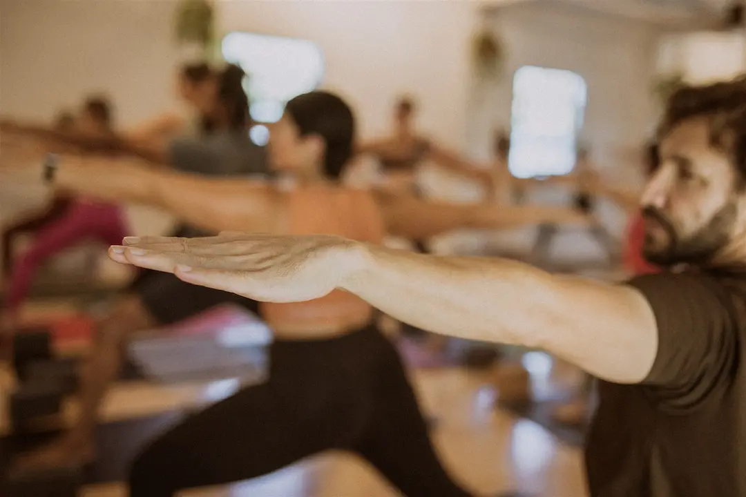 Warrior II pose in a yoga class